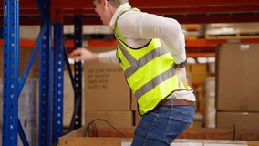 Male warehouse engineer manager suffering from back injury - Powered by Shutterstock - Get 15% off with code: PIKWIZARD15