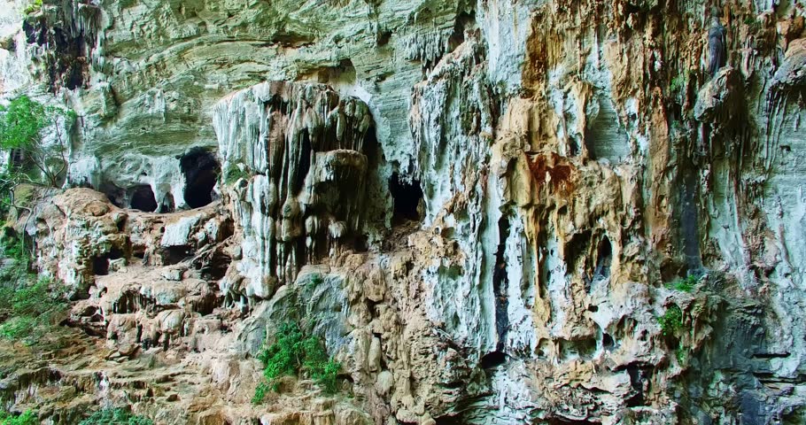 .aerial view Beautiful stalactites in the cave walls.The cave walls were covered in shimmering stalactites, .which created an ethereal atmosphere. .the large hole on the roof the cave.