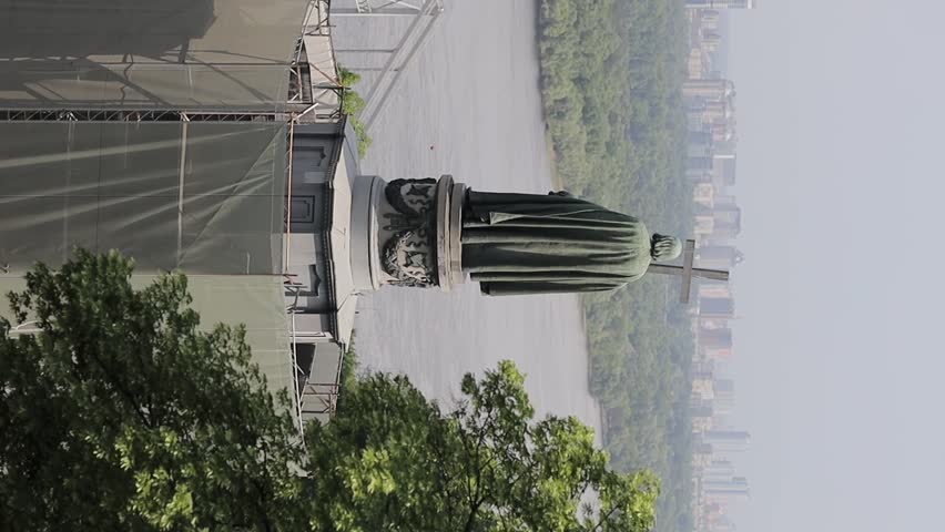 Monument to Vladimir the Great on Vladimirskaya Gorka among the trees, Kyiv Ukraine. Vladimir the Great. monument to Volodymyr the Great in Kyiv, Ukraine, during the Russo-Ukrainian War.