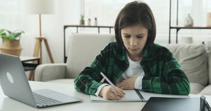 Schoolboy Engaged in Online Learning and Homework