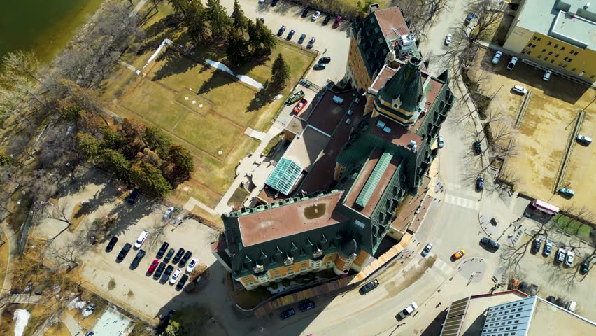 Aerial view of the downtown area of Saskatoon, Saskatchewan, Canada. Reveal of Marriott Bessborough Hotel in the middle of Downtown Saskatoon, Top Down view, Saskatchewan, Canada