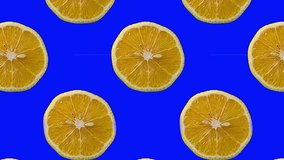 A pattern of sliced oranges moving from left to right, top view.