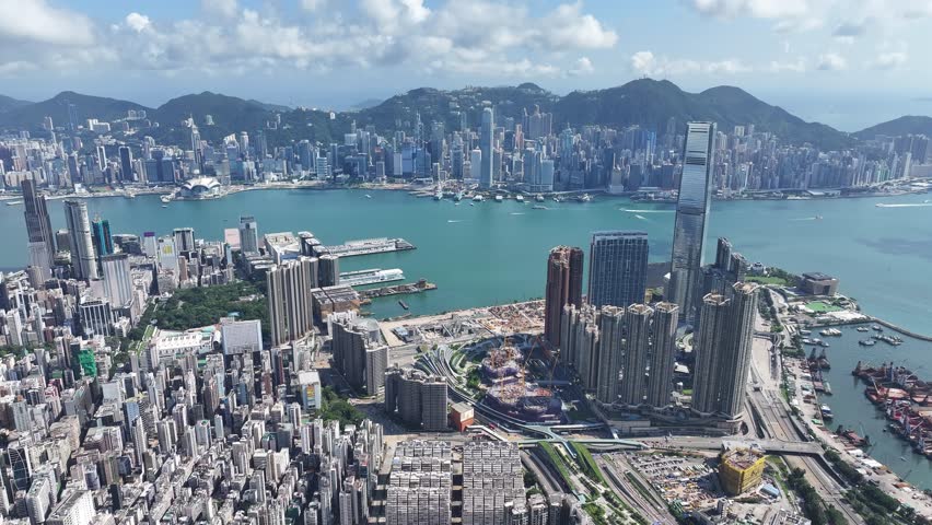 Drone aerial shot city Skyview in West Kowloon Cultural District Tsim Sha Tsui Mong Kok Jordan Yau Ma Tei Central Hong Kong Island, a commercial hub with the financial of the Victoria Harbour Royalty-Free Stock Footage #1104810891