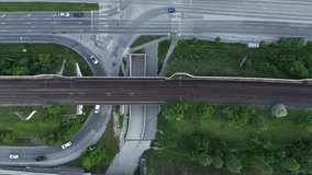 City traffic with roundabout rain tracks and traffic horizontal video