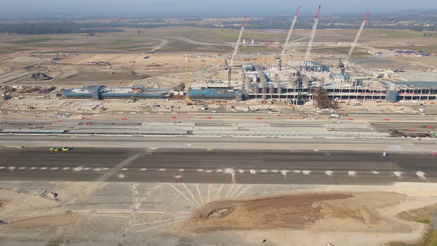 WESTERN SYDNEY, NSW, AUSTRALIA – JUNE 3, 2023: Aerial drone view of the construction site of the new Western Sydney International Airport at Badgerys Creek in Western Sydney, NSW in June 2023 Royalty-Free Stock Footage #1104829327