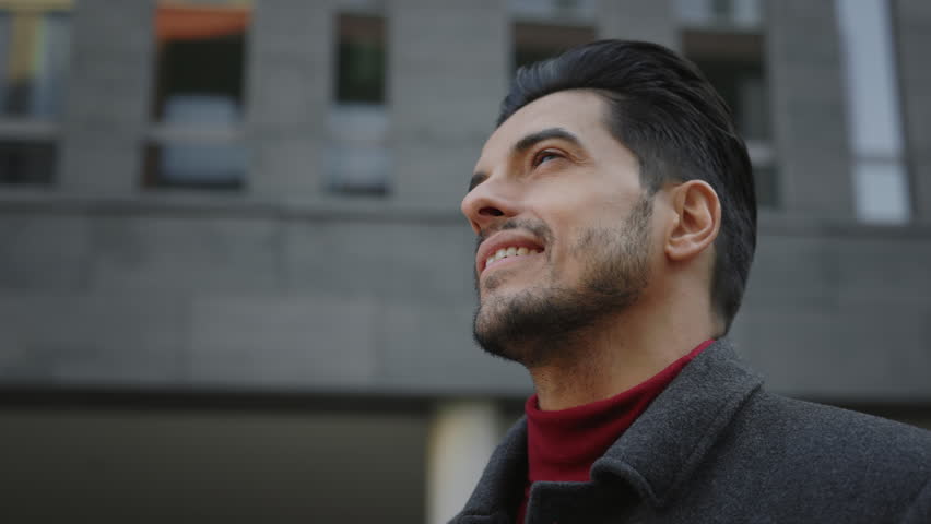 Handsome multi ethnic man is enjoying the city, thinking dreaming about something. Multi raced student utdoors looking around, waiting for the taxi, searching road way thinking thoughtful face Royalty-Free Stock Footage #1104834593