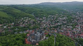 Drone shot of Wernigerode Castle ( Schloss Wernigerode ) . Wernigerode Castle is a schloss located in the Harz mountains above the town of Wernigerode in Saxony-Anhalt, Germany.