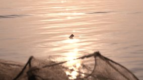 Reflection of the sun with fish net on foreground, relaxing background video