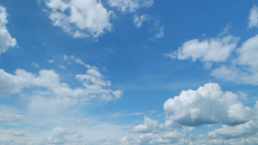 Clouds move in the blue sky. Tropical sky at day time, only white and blue colors. Semi-transparent layers on different height. Timelapse. Royalty-Free Stock Footage #1104847715