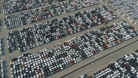 Aerial top view of new cars parking for sale stock lot row, dealer inventory import and export business commercial worldwide, Automobile and automotive industry distribution logistic global transport - Powered by Shutterstock - Get 15% off with code: PIKWIZARD15