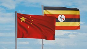 Republic of Uganda and China flag waving together in the wind on blue sky, cycle looped video, two country cooperation concept