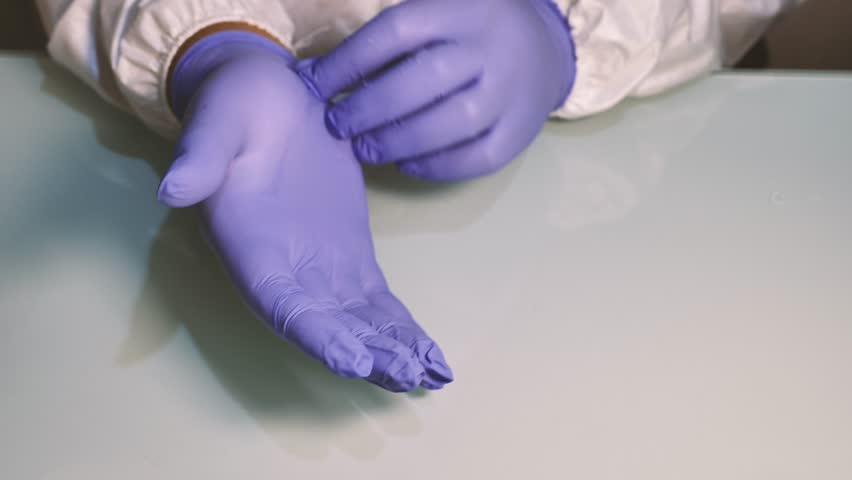 The activity of removing medical gloves. Royalty-Free Stock Footage #1104849401