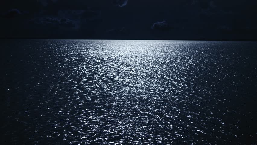 Night scene. The moon is reflected in the water, the moon path on the surface of the river.
