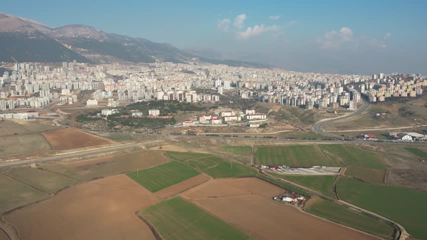 The city center and the Klavuzlu Dam Lake over the Kahramanmaraş Avşar Village | Shutterstock HD Video #1104861315