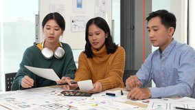 Team of ux developer and ui designer brainstorming interface wireframe design.Creative digital development agency - Powered by Shutterstock - Get 15% off with code: PIKWIZARD15