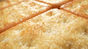 Captivated by the sight of sugar-coated biscuits in this stunning macro video, showcasing their flawless textures and the delicate balance between the sugary coating and the buttery biscuit beneath.
