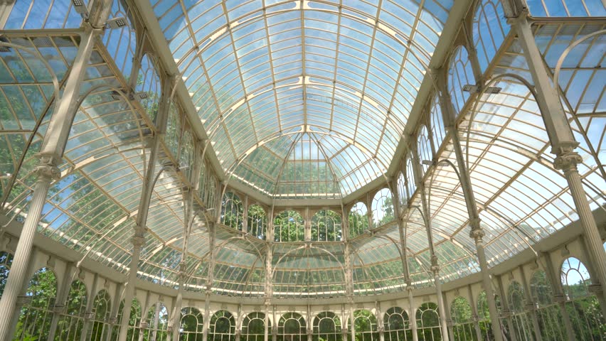 Roof of avanzano glass palace with the blue sky and lush park greenery as the background on the other side. Its advancing architectural details are truly magical.