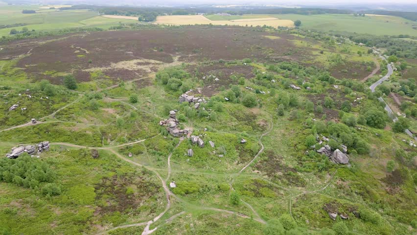 This aerial drone video shows the Brimham Rocks from above. The Brimham Rocks is a natural stone formation in the Yorkshire Dales National Park, England. These beautiful rocks are found in the moor. 