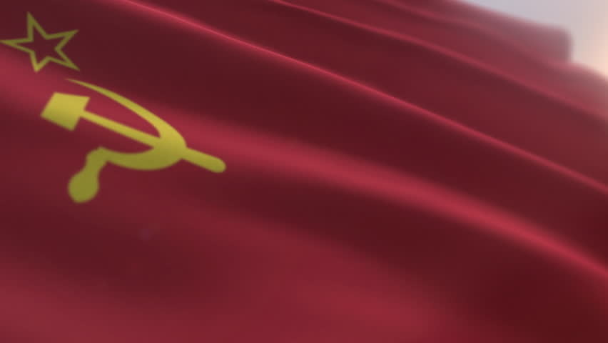 Fluttering the old Soviet Union national flag. National flag of the Union of Soviet Socialist Republics. National flag of the Soviet Union with a hammer and sickle in the red background. Royalty-Free Stock Footage #1104878443