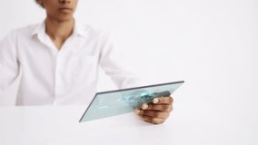 Scientist interacting with newly created virus model on holographic tablet. Futuristic technology on white background - Powered by Shutterstock - Get 15% off with code: PIKWIZARD15
