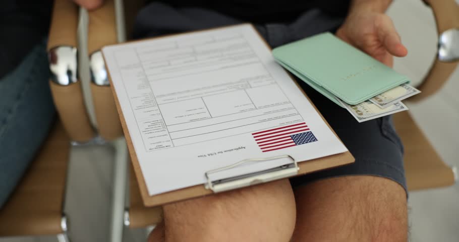 Closeup of group of people filling out US visa application form Royalty-Free Stock Footage #1104881445