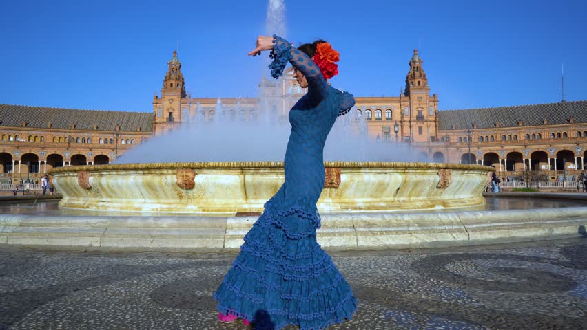 Woman dancing a traditional dance like flamenco in Seville, Andalusia, Spain.