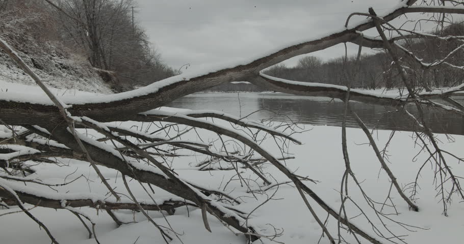 Slider Movement of Minnesota River in Gray Dreary Cold Winter Day with Snow