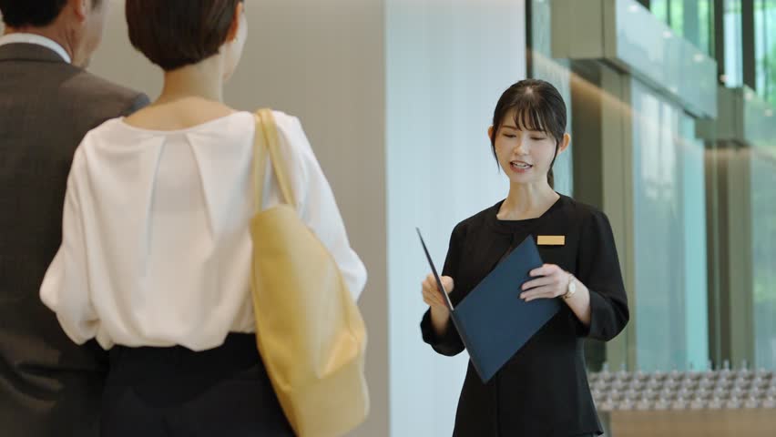 Hotel staff showing guests around Royalty-Free Stock Footage #1104894819