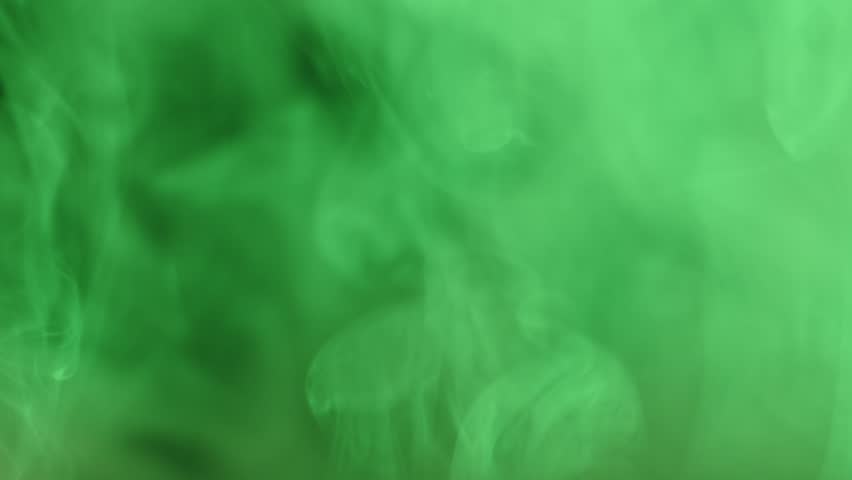 Green smoke in the light of different colors on a black background, abstract background, dancing fog. 8K downscale, 4K. Royalty-Free Stock Footage #1104895055