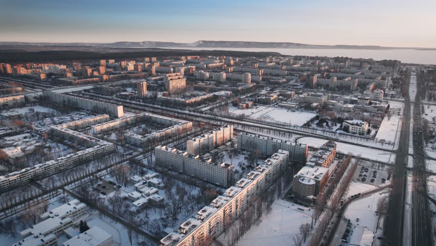 Aerial view. Winter panorama of the city of Tolyatti in the Samara region. Snow-covered streets of a provincial and industrial Russian city. Royalty-Free Stock Footage #1104897285