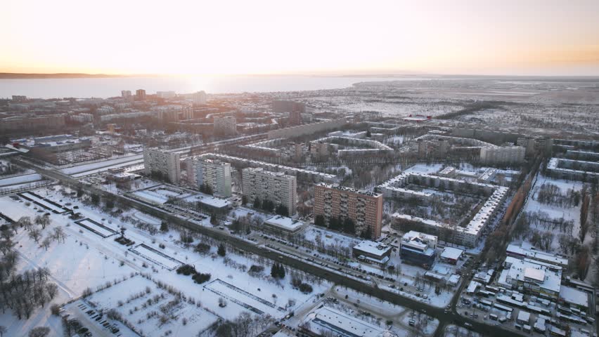Aerial view. Winter panorama of the city of Tolyatti in the Samara region. Snow-covered streets of a provincial and industrial Russian city. Royalty-Free Stock Footage #1104897317