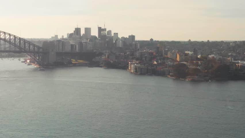 Sydney Harbour Bridge backlit, aerial view on a beautiful summer morning, NSW, Australia