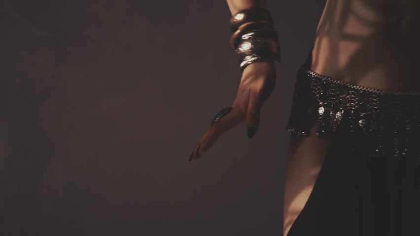 Sensual woman dancing in light and shadow
