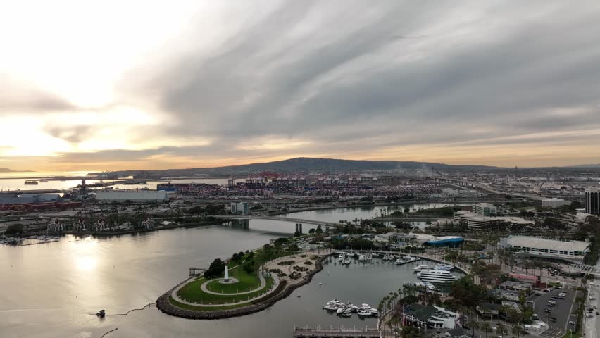 Aerial descending on marina with downtown cityscape views with boat and yacht. Long beach california. Aerial view of Long Beach skyline. Top view from drone of long beach CA.