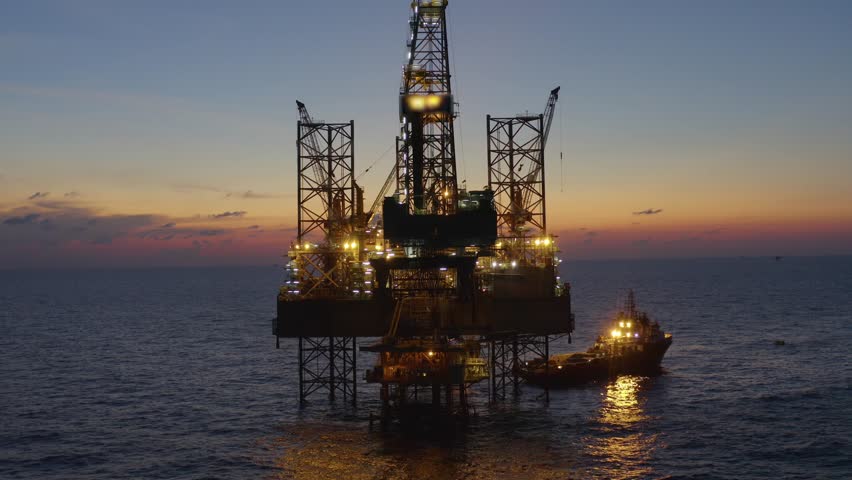 Aerial view of offshore jack up drilling rig during early night time - oil and gas industry
 Royalty-Free Stock Footage #1104926509
