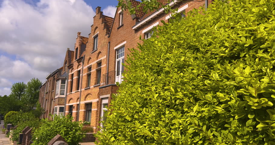 Establishing shot. Landmarks of Belgium architecture. People and tourists are walking. Gothic buildings in the background