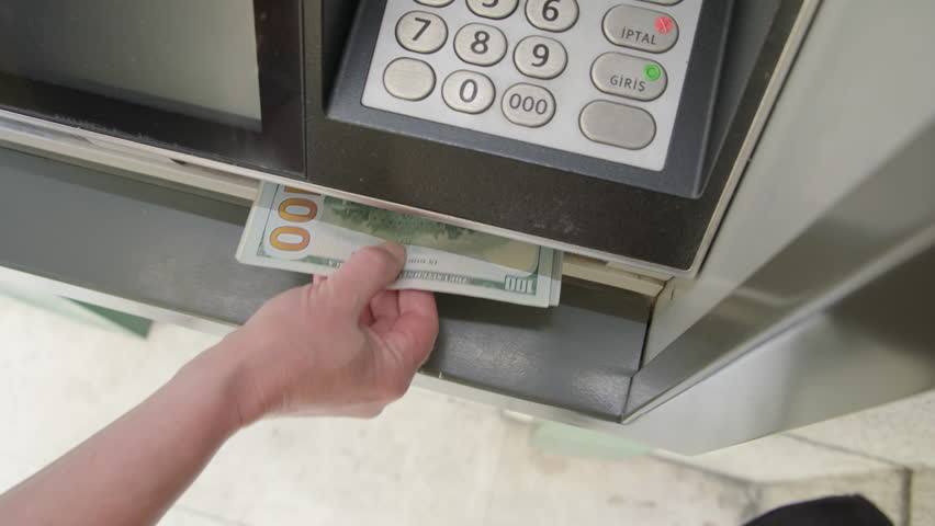 ATM dispenses cash dollars. Hand takes money banknotes from ATM close-up. Royalty-Free Stock Footage #1104930733