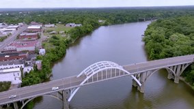 Edmund Pettus Bridge in Selma, Alabama with drone video moving in a circle revealing city.