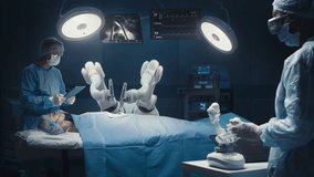 Surgeon Wearing AR Headset And Using High-Precision Remote Controlled Robot Arms To Operate On Patient, While His Colleague Checking Vitals On Tablet In Hospital. Doctors Working With Robotic Limbs. - Powered by Shutterstock - Get 15% off with code: PIKWIZARD15