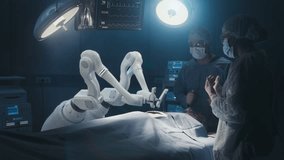 Two Surgeons Observing High-Precision Programmable Automated Robot Arms Operating Patient In High-Tech Hospital. Robotic Limbs Performing Complicated Nanosurgery, Doctors Looking At Vitals On Monitor. - Powered by Shutterstock - Get 15% off with code: PIKWIZARD15