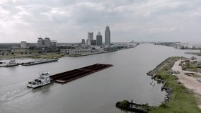 Barge in Mobile Bay in Mobile, Alabama with drone video moving forward.