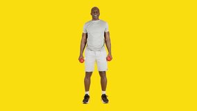 African man doing curl biceps exercise with dumbbells alternating arm