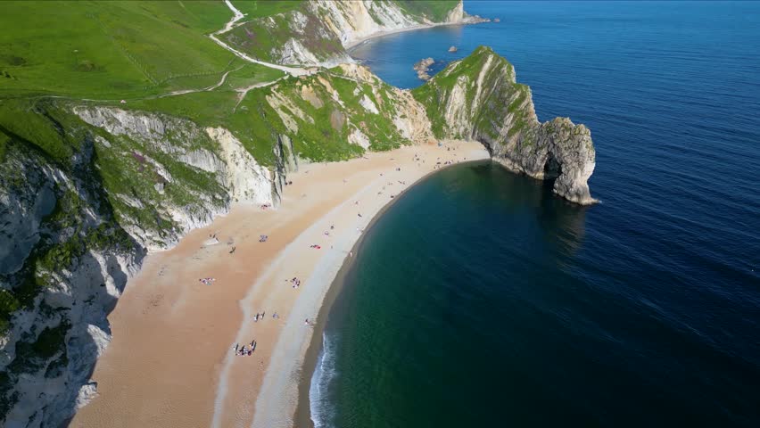 Aerial view of the beautiful Durdle Door Beach in Lulworth, Dorset, England, with turquoise sea
