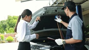 Male auto mechanic skillfully inspects car air conditioning cooling system of female customer service to repair damage and refrigerant leak while driving a vehicle in hot weather. - Powered by Shutterstock - Get 15% off with code: PIKWIZARD15