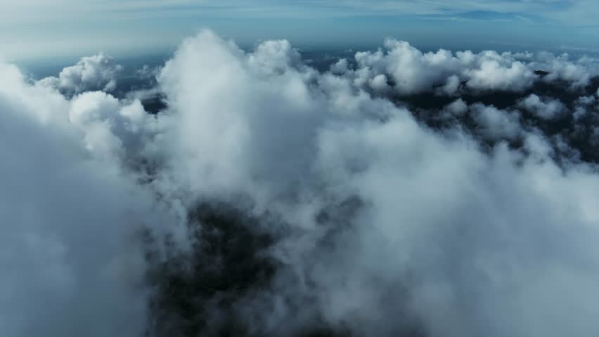 Aerial View Flying over fog in sunrise sky,Colorful sky beautiful ocean of clouds at sunrise, Sun is rising above the endless sea of clouds until the horizon, Amazing nature landscape background
