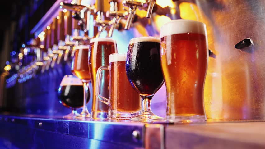 Close-up image of beer glasses with dark and lager beer. Selective focus. Cool, chill drink. Refreshment. Bar, pub. Degustation. Concept of alcohol drink, party, taste, relaxation. Ad