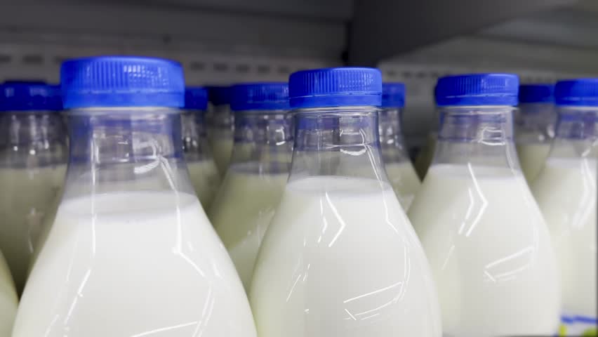 milk in plastic bottles on the supermarket shelves. healthy eating protein cow milk concept. dairy products on store shelves. dairy products in plastic on store shelves lifestyle Royalty-Free Stock Footage #1104973785