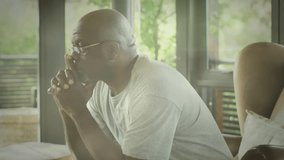 Animation of glowing lights of water over a sad senior african american man. Loneliness awareness day concept digitally generated video. - Powered by Shutterstock - Get 15% off with code: PIKWIZARD15