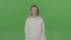 Horizontal shot on green screen background. Cute girl consultant talks to you denies changes in the face rips off the microphone swears into it throws headset on the floor and leaves the frame. - Powered by Shutterstock - Get 15% off with code: PIKWIZARD15