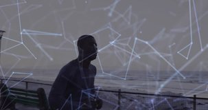 Animation of network of connections over a running african american man. Global connections, wellbeing, fitness and healthy lifestyle concept digitally generated video.